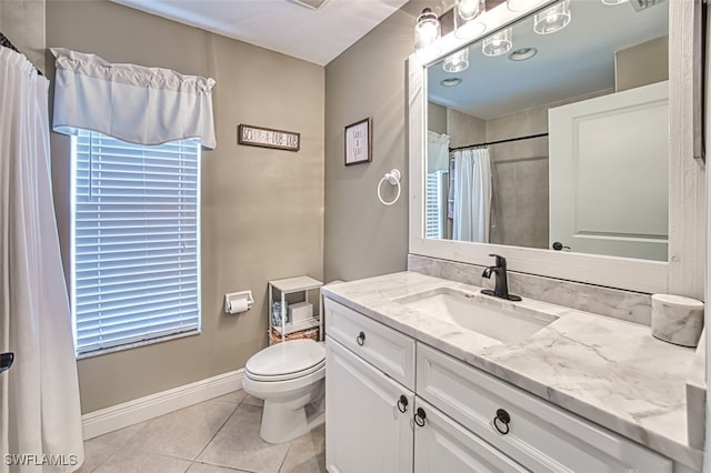 full bathroom with toilet, tile patterned flooring, vanity, and baseboards