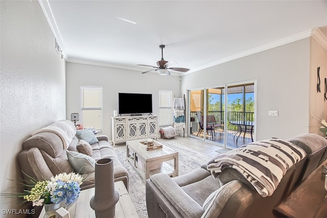 living area with crown molding and a wealth of natural light