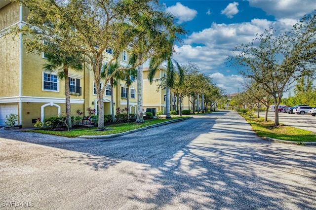 view of street featuring curbs and a residential view