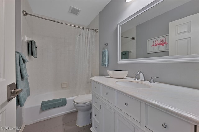 full bathroom with shower / bath combo with shower curtain, tile patterned floors, toilet, and vanity