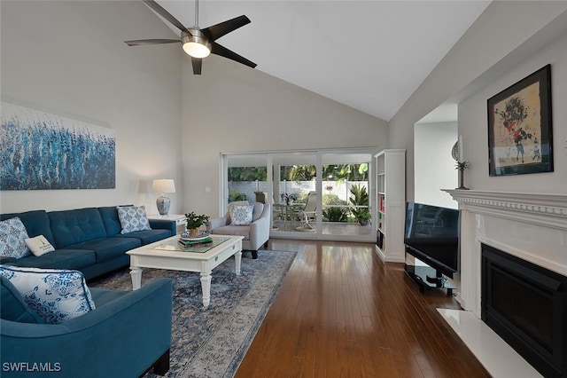 living room with dark wood-type flooring, ceiling fan, and high vaulted ceiling