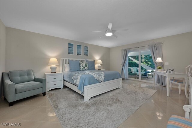 bedroom featuring access to exterior, light tile patterned floors, and ceiling fan