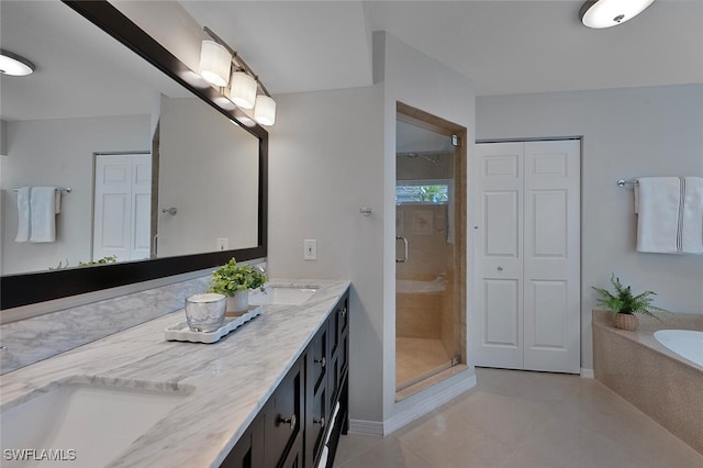 bathroom featuring tile patterned flooring, vanity, and an enclosed shower