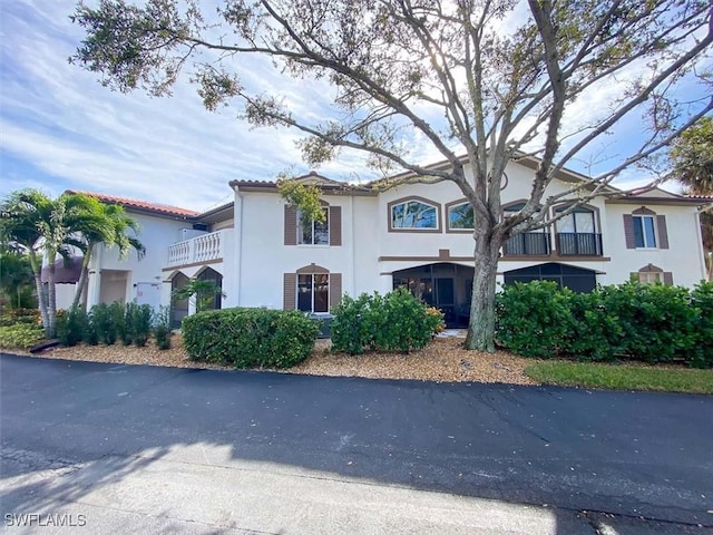 11921 Seabreeze Cove Ln Unit 202, Fort Myers, FL 33908 - view of front of home with stucco siding and a balcony