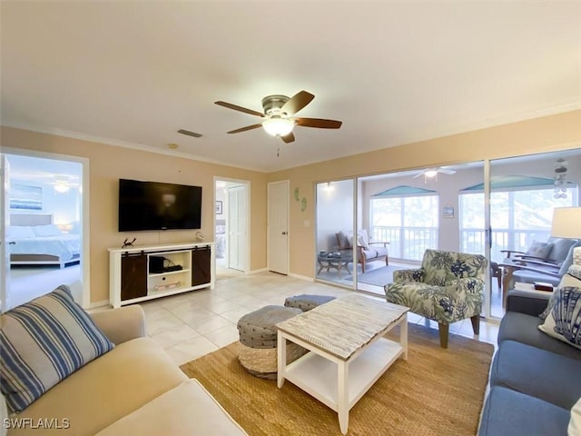 11921 Seabreeze Cove Ln Unit 202, Fort Myers, FL 33908 - living room featuring a ceiling fan, ornamental molding, baseboards, and light tile patterned flooring