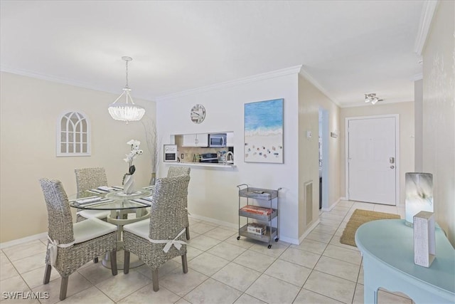 11921 Seabreeze Cove Ln Unit 202, Fort Myers, FL 33908 - dining space featuring ornamental molding, light tile patterned floors, and a chandelier