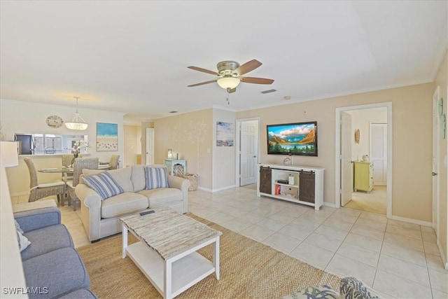 11921 Seabreeze Cove Ln Unit 202, Fort Myers, FL 33908 - living room with a ceiling fan, ornamental molding, and light tile patterned flooring