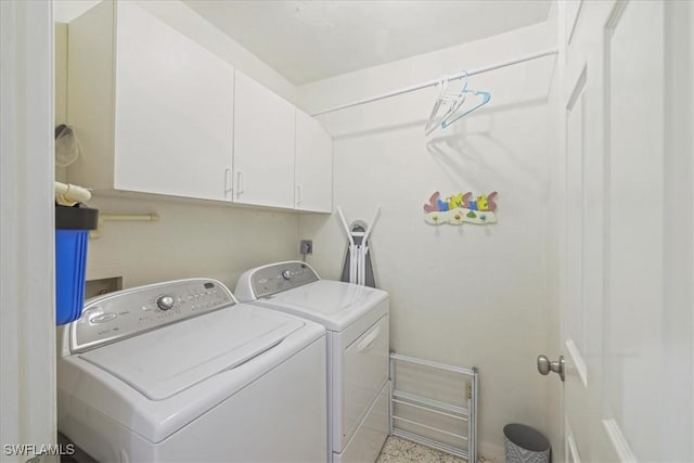 11921 Seabreeze Cove Ln Unit 202, Fort Myers, FL 33908 - laundry area featuring washer and dryer and cabinet space