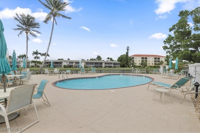 11921 Seabreeze Cove Ln Unit 202, Fort Myers, FL 33908 - community pool with a patio