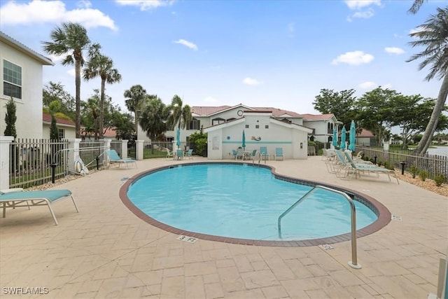 11921 Seabreeze Cove Ln Unit 202, Fort Myers, FL 33908 - community pool featuring a patio
