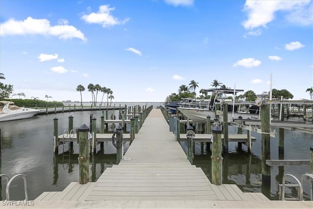 11921 Seabreeze Cove Ln Unit 202, Fort Myers, FL 33908 - dock featuring a water view and boat lift