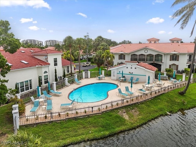 11921 Seabreeze Cove Ln Unit 202, Fort Myers, FL 33908 - community pool with a patio area