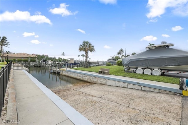 11921 Seabreeze Cove Ln Unit 202, Fort Myers, FL 33908 - dock with a water view and a lawn