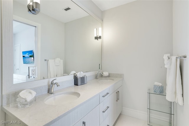 bathroom featuring tile patterned floors and vanity