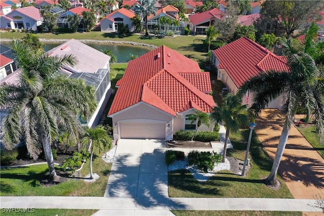 drone / aerial view with a water view