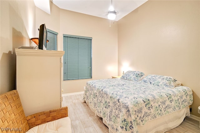 bedroom featuring light hardwood / wood-style flooring and ceiling fan