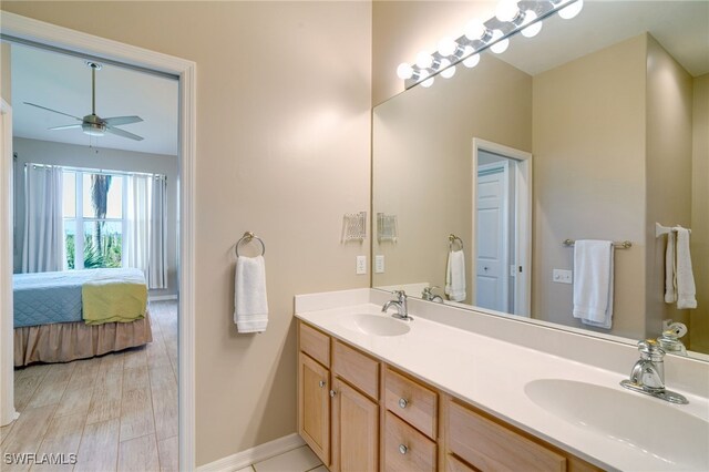 bathroom featuring ceiling fan, vanity, and hardwood / wood-style flooring