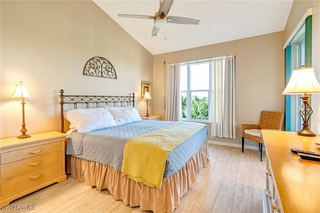 bedroom with light hardwood / wood-style floors, vaulted ceiling, and ceiling fan