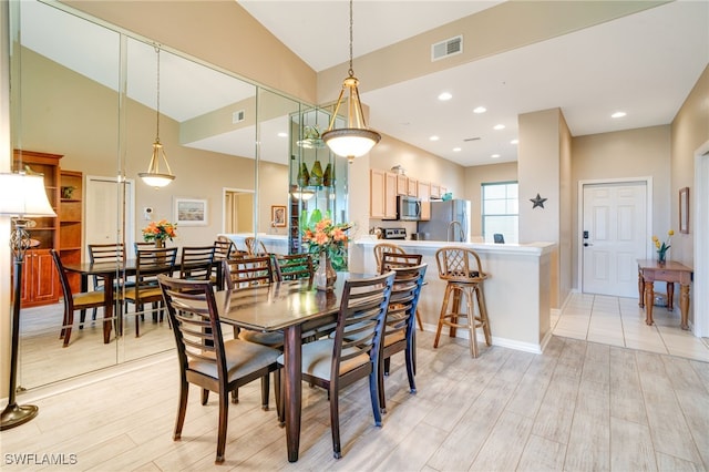 dining room featuring lofted ceiling