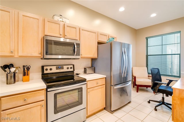 kitchen with tasteful backsplash, light brown cabinetry, light tile patterned flooring, and stainless steel appliances