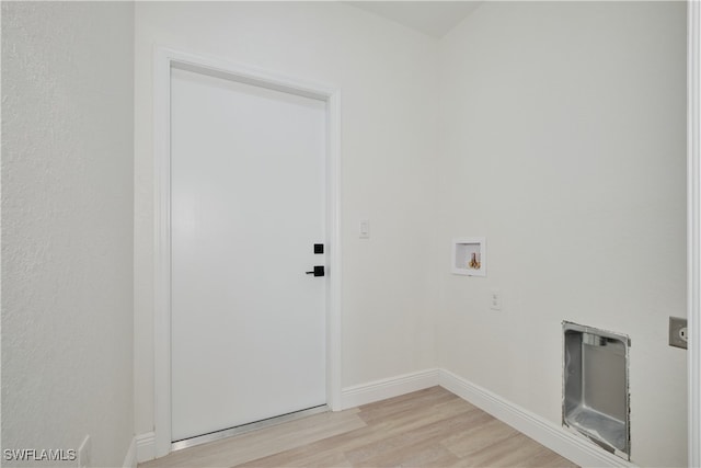 washroom featuring light hardwood / wood-style flooring and washer hookup