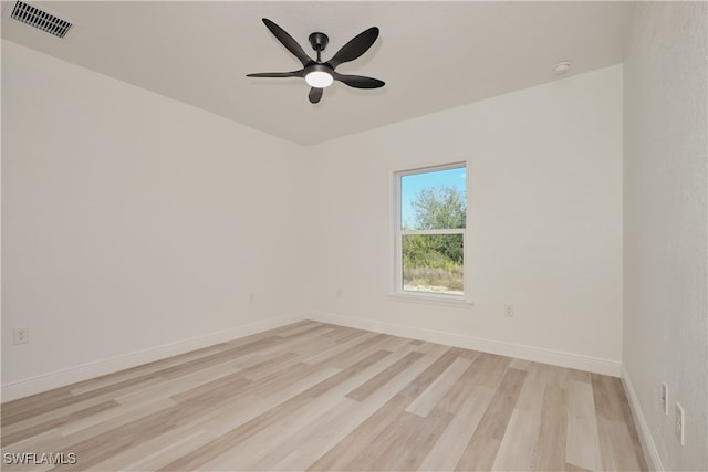 empty room featuring ceiling fan and light hardwood / wood-style floors