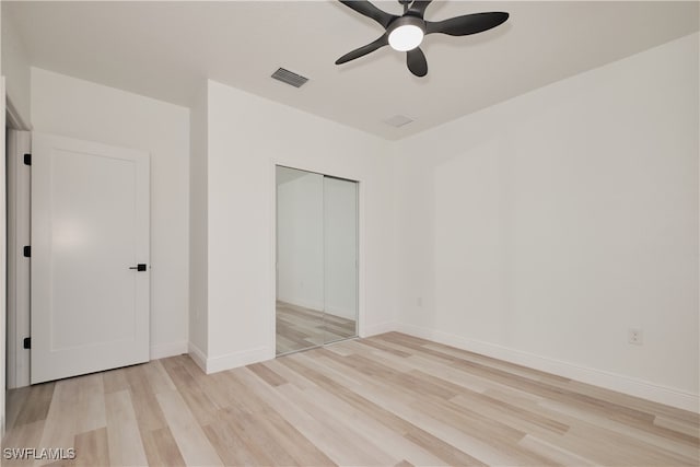 unfurnished bedroom featuring a closet, ceiling fan, and light hardwood / wood-style floors
