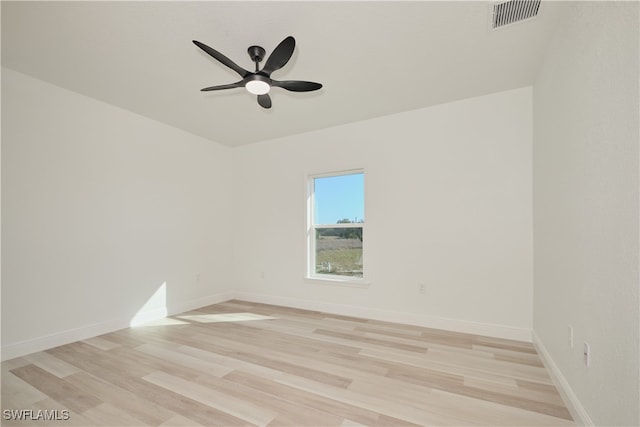 spare room featuring light hardwood / wood-style floors and ceiling fan