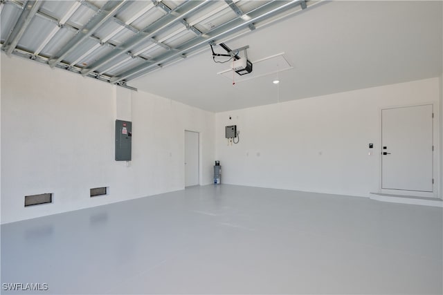 garage featuring electric panel and a garage door opener