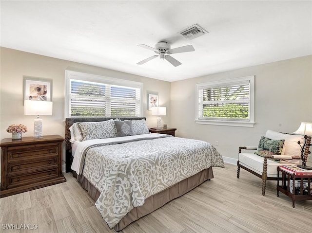 bedroom with light wood-type flooring and ceiling fan