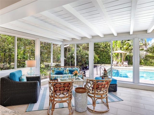 sunroom with beamed ceiling