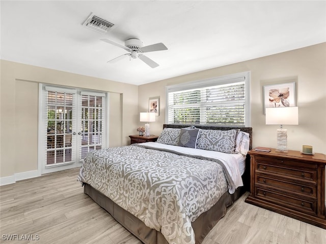 bedroom with access to exterior, ceiling fan, and light hardwood / wood-style flooring