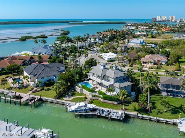 birds eye view of property with a water view