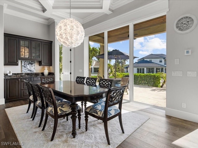 dining room with beamed ceiling, coffered ceiling, and ornamental molding