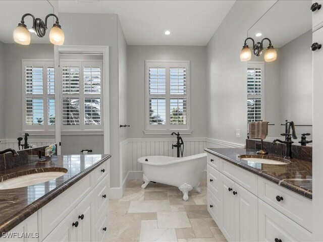 bathroom featuring a bathtub and vanity