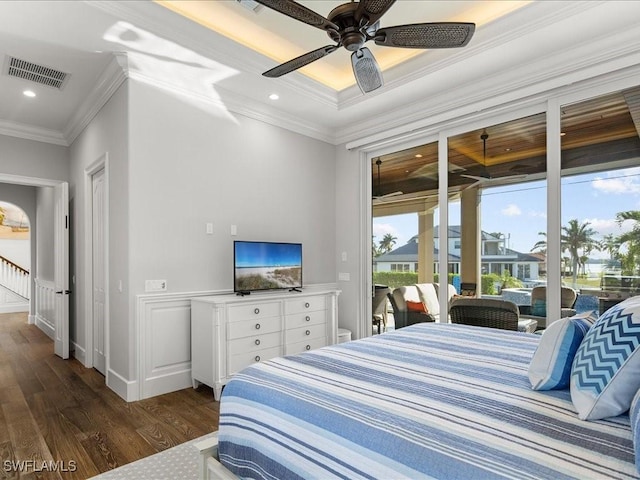 bedroom with dark hardwood / wood-style flooring, access to outside, ceiling fan, and ornamental molding