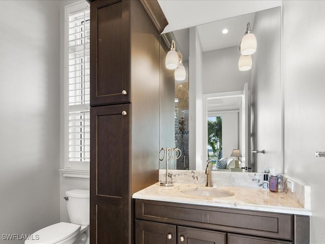 bathroom with vanity and toilet