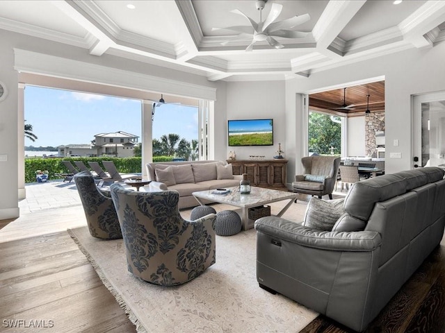 living room with wood-type flooring, ceiling fan, crown molding, and coffered ceiling