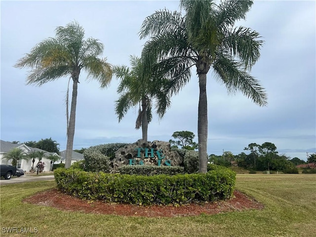 view of home's community with a lawn