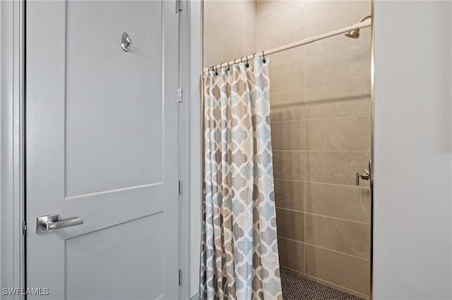 bathroom featuring a shower with curtain