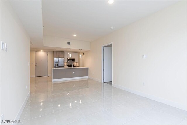 26610 Rosewood Pointe Dr Unit 308, Bonita Springs, FL 34135 - unfurnished living room featuring light tile patterned floors