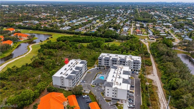 26610 Rosewood Pointe Dr Unit 308, Bonita Springs, FL 34135 - drone / aerial view featuring a water view