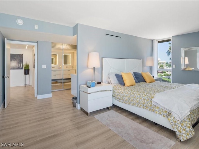 bedroom featuring hardwood / wood-style flooring and a closet