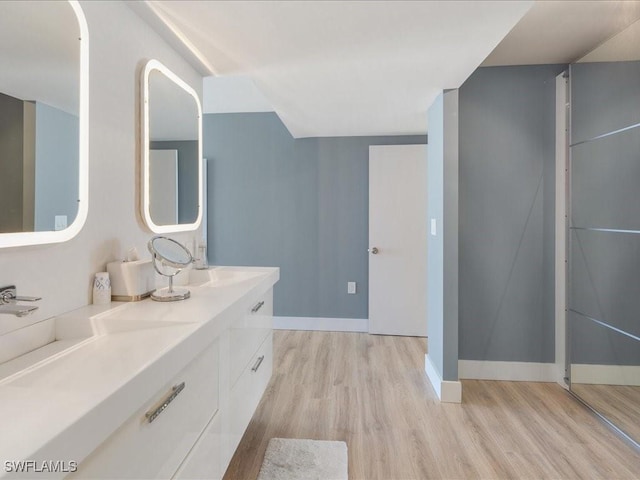 bathroom featuring vanity and hardwood / wood-style floors