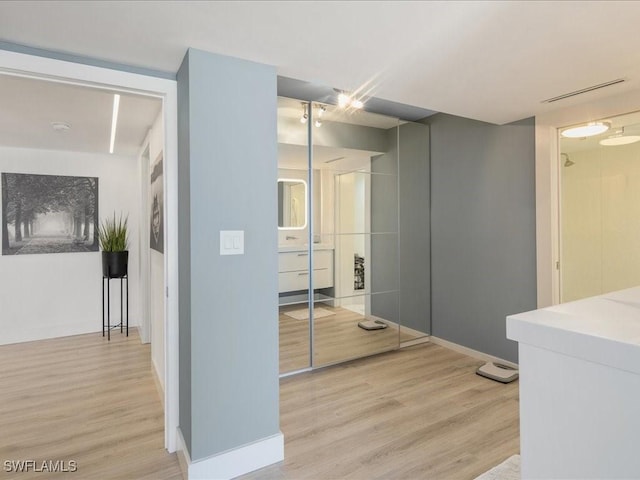 hallway with light wood-type flooring