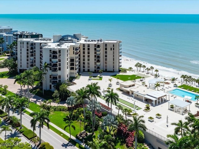 bird's eye view featuring a water view and a view of the beach