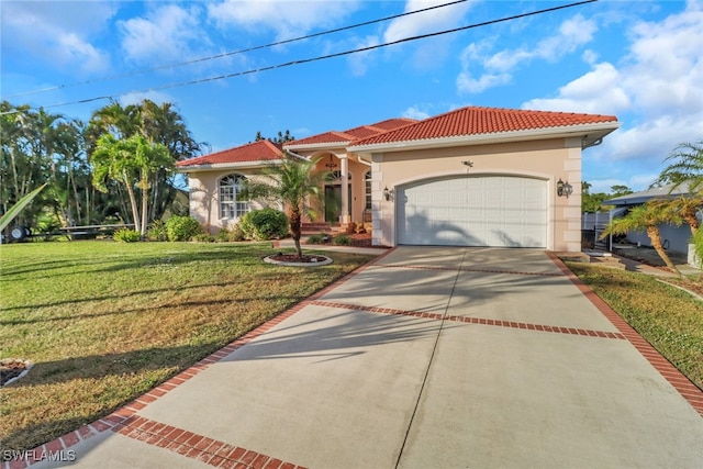 mediterranean / spanish house with a front yard and a garage