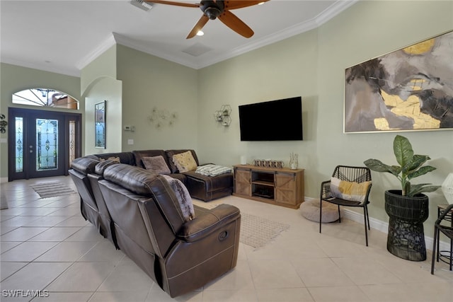 tiled living room featuring ceiling fan and ornamental molding