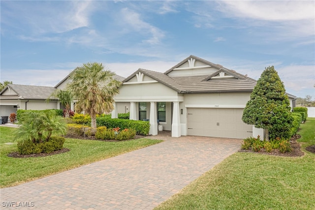 view of front of property with a garage and a front yard