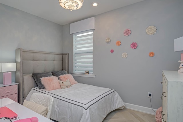 bedroom featuring light parquet flooring